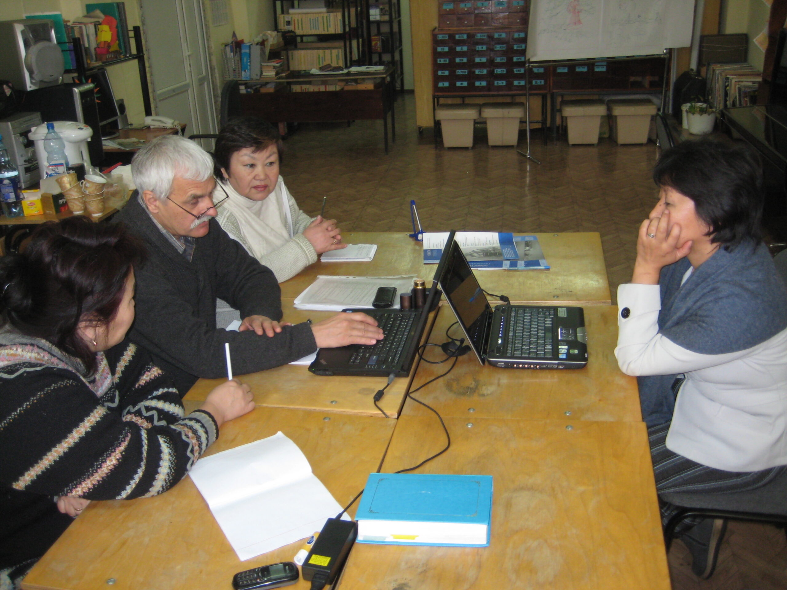 Eurasian child holding a baby animal